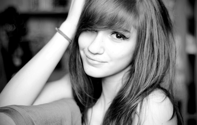 woman with long hair smiling