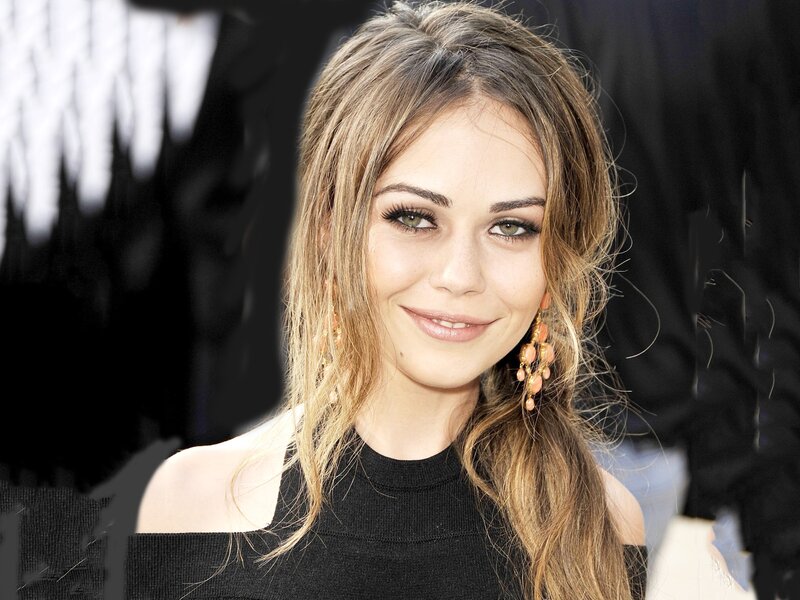 woman with long hair smiling
