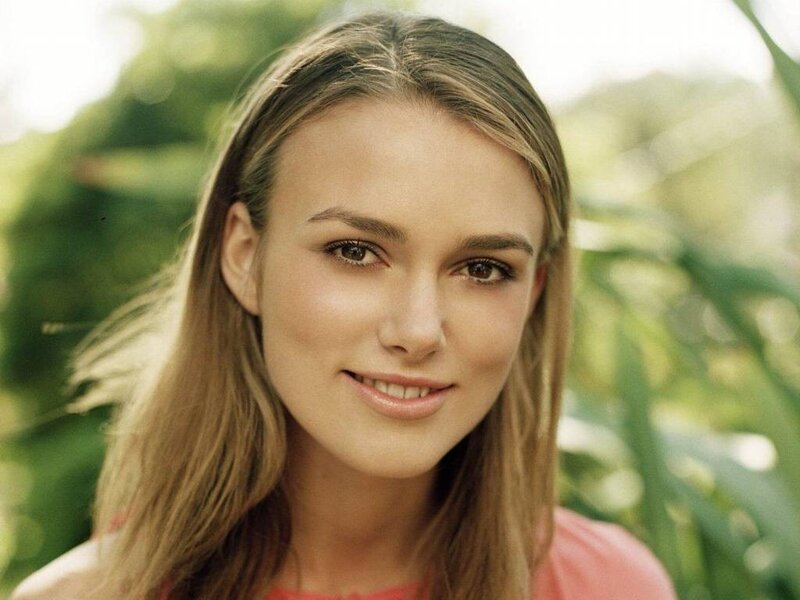 woman with long hair smiling