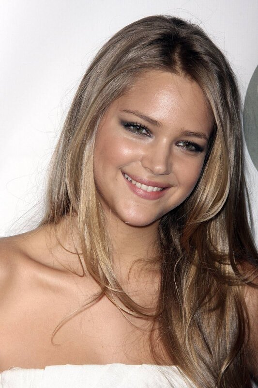 woman with long hair smiling