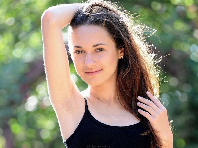 woman with long hair smiling