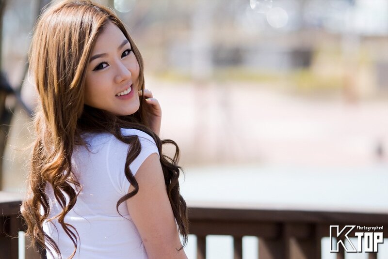 woman with long hair smiling