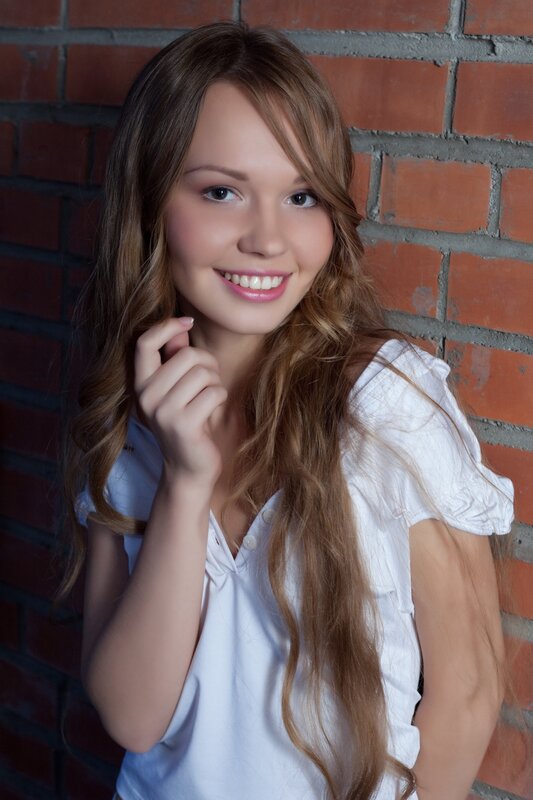 woman with long hair smiling