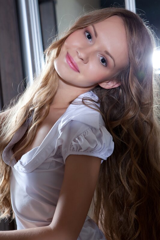 woman with long hair smiling