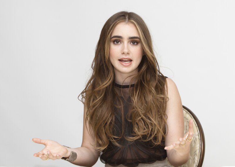 woman with long hair speaking