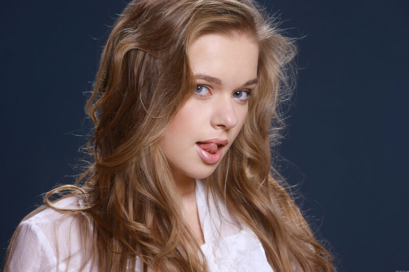 woman with long hair sticking out tongue