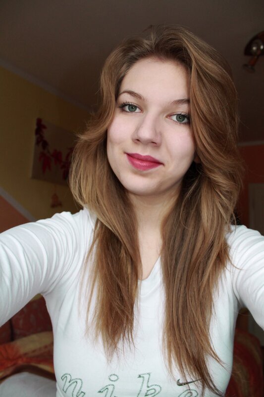woman with long hair taking selfie