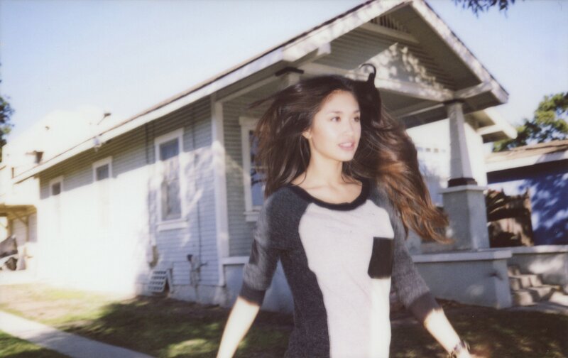 woman with long hair walking outside