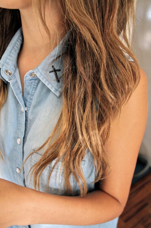 woman with long hair wearing denim shirt