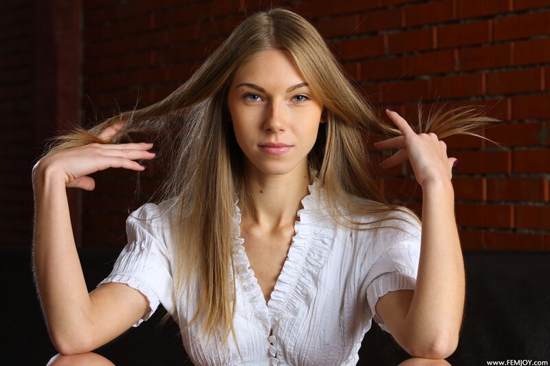 Woman with Long Hair — White, Neutral, Photograph, Brick Wall