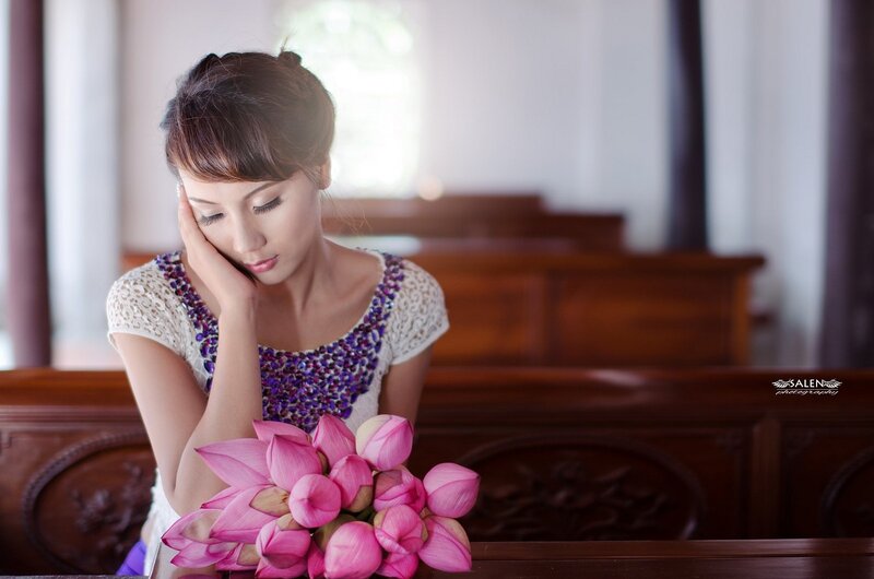 woman with lotus flowers