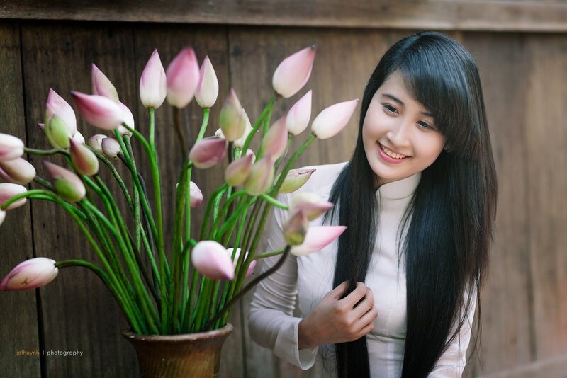 Woman with lotus flowers