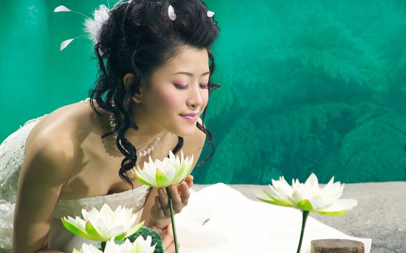 woman with lotus flowers