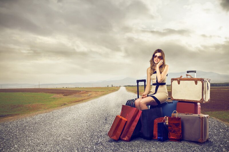 Woman with Luggage on Road