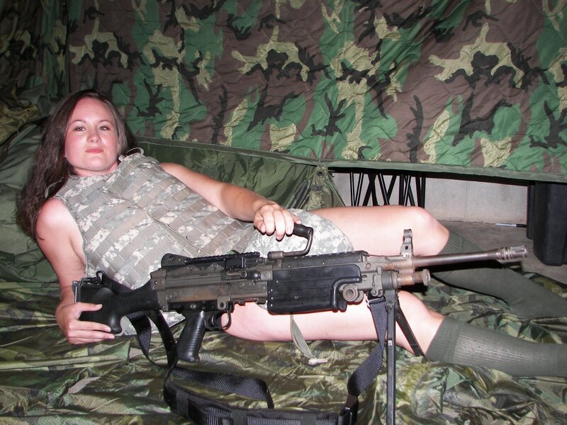 woman with machine gun in tent