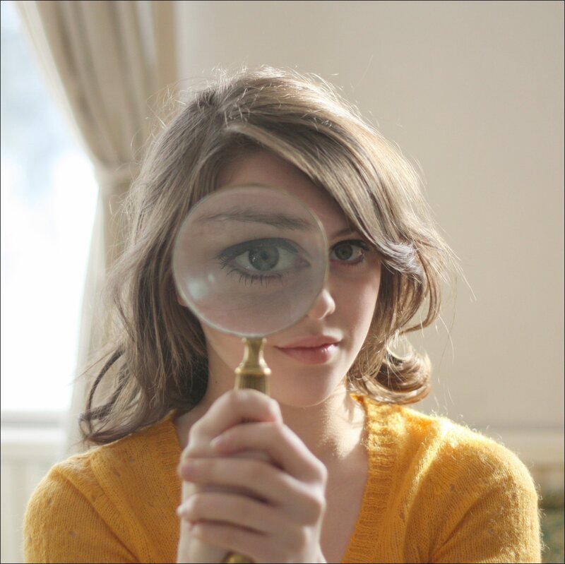 woman with magnifying glass