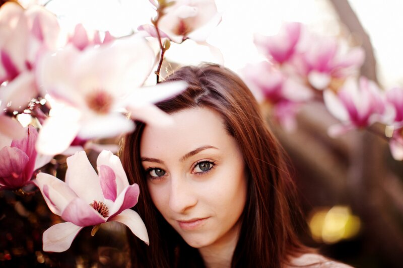 woman with magnolia flowers