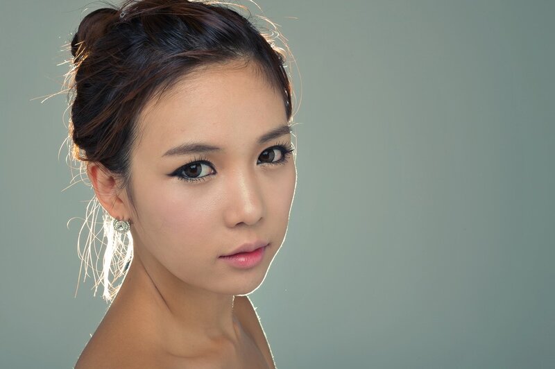 woman with makeup and earrings