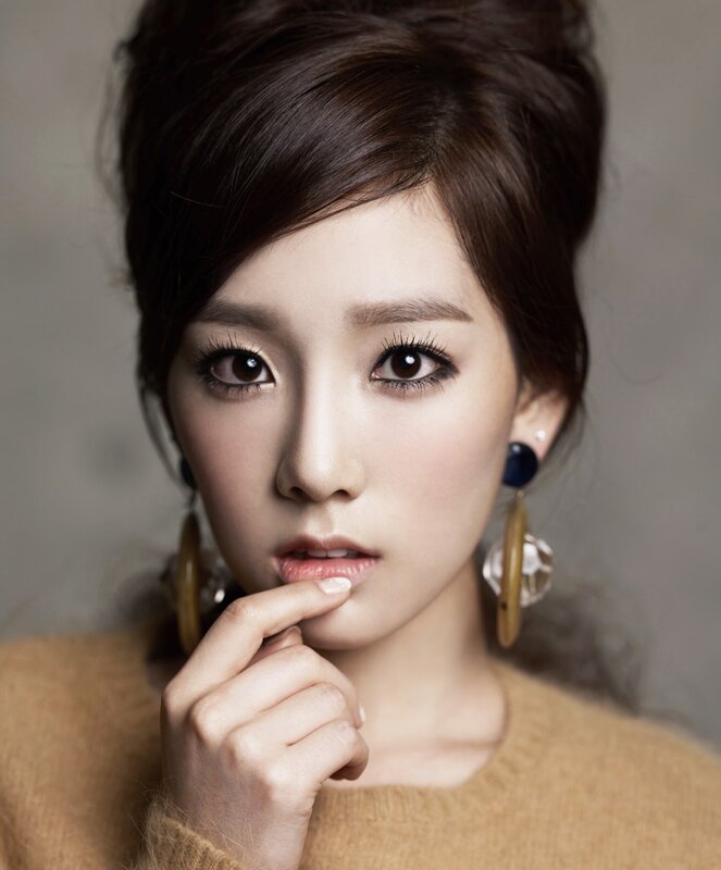 woman with makeup and earrings