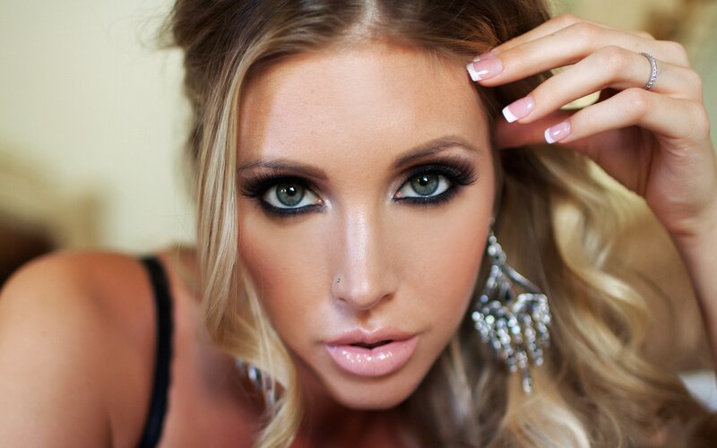 woman with makeup and earrings