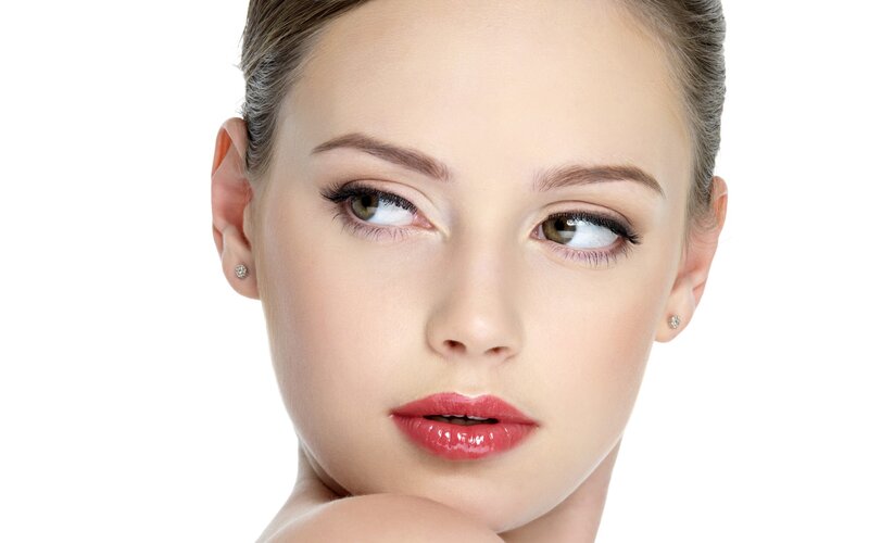 woman with makeup and earrings