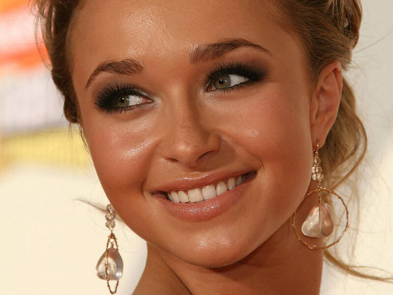 woman with makeup and earrings