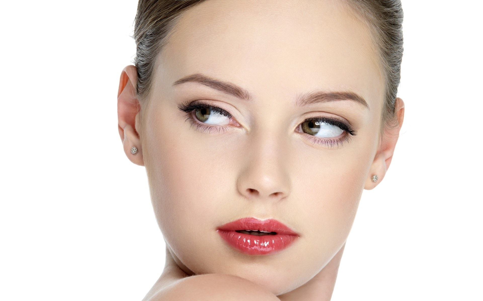 woman with makeup and earrings
