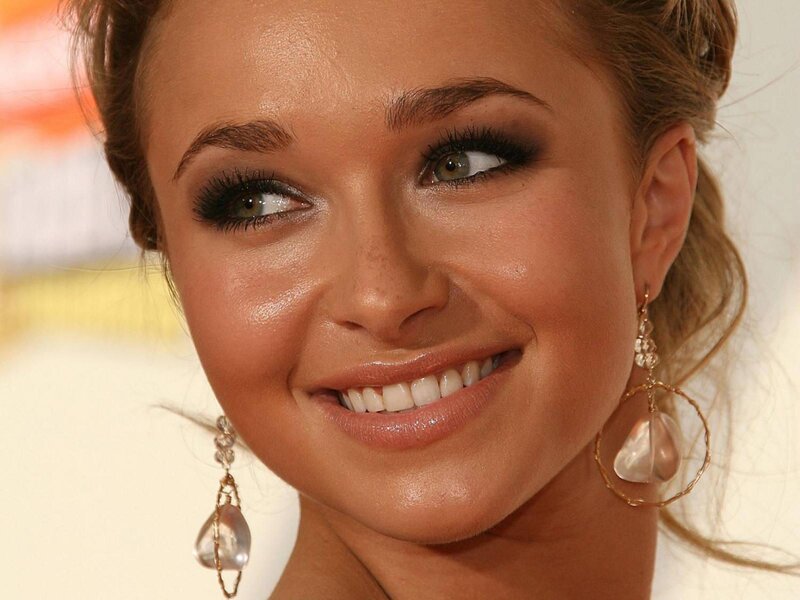 woman with makeup and earrings