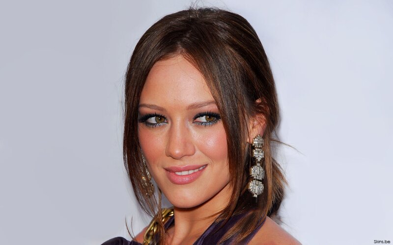 woman with makeup and earrings