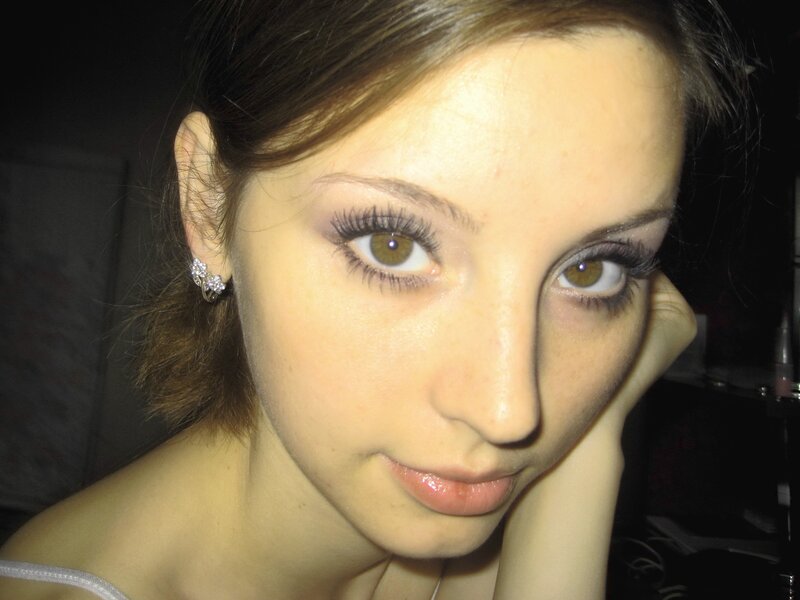woman with makeup and earrings