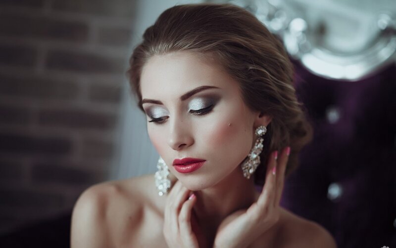 Woman with Makeup and Earrings — Brown, Dramatic, Photograph