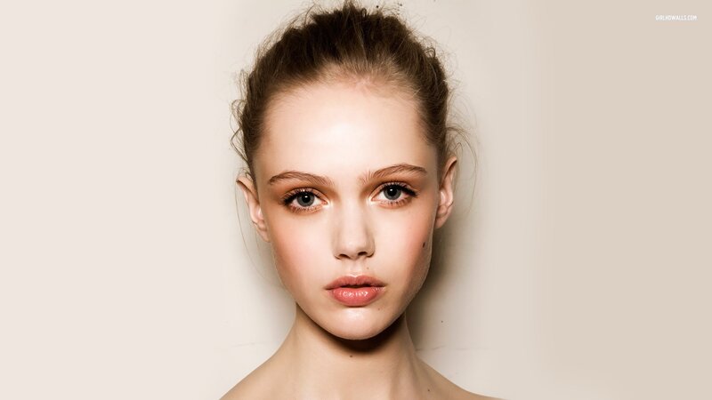 woman with makeup and hair up