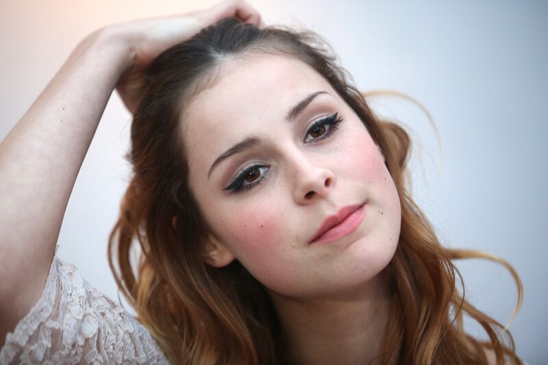 woman with makeup and hand in hair