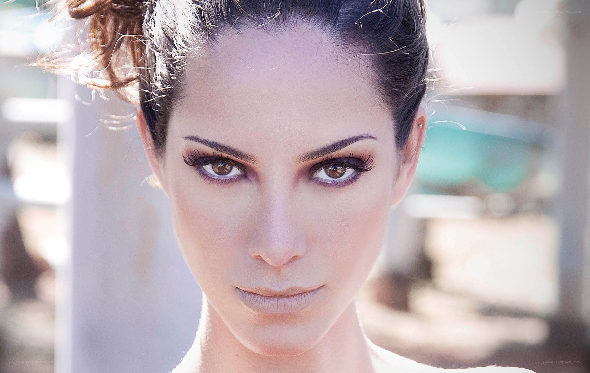 woman with makeup looking at camera