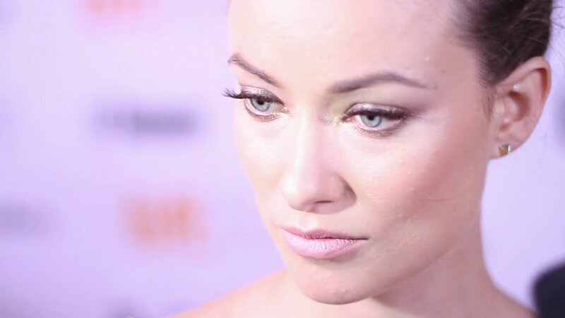 woman with makeup looking down