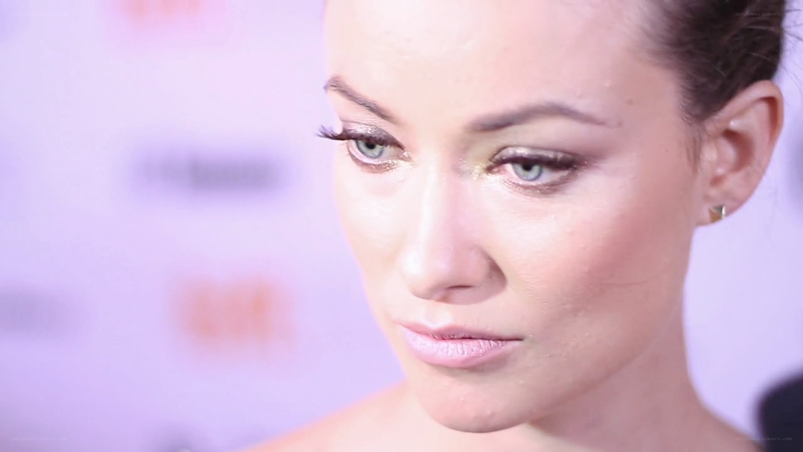 woman with makeup looking down