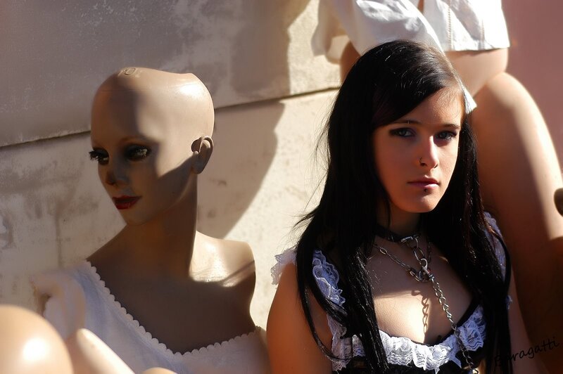woman with mannequin in sunlight