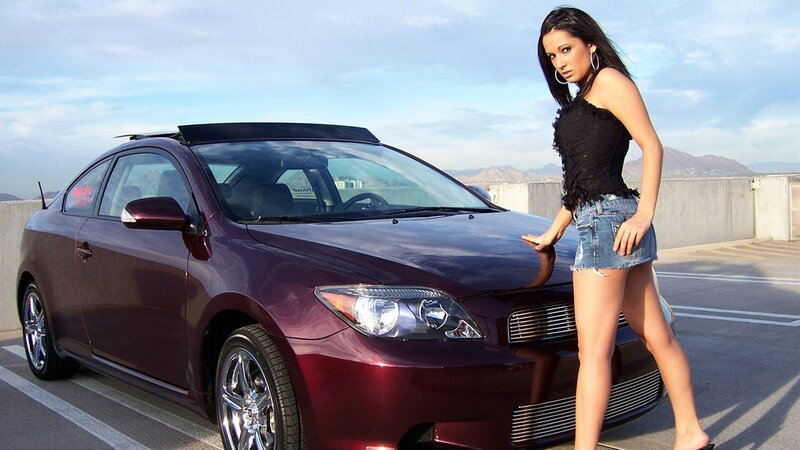 woman with maroon car