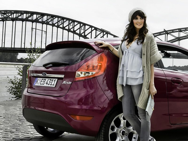 Woman with maroon Ford Fiesta