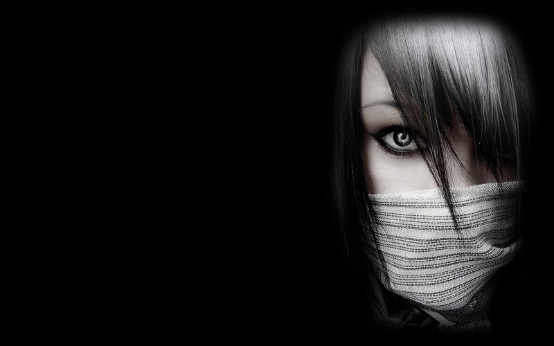 woman with mask and dark eyes