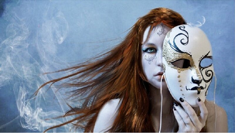 woman with mask and white face paint