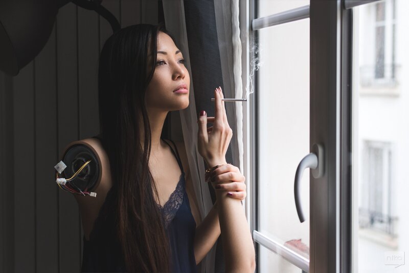 Woman with Mechanical Arm — Black, Contemplative