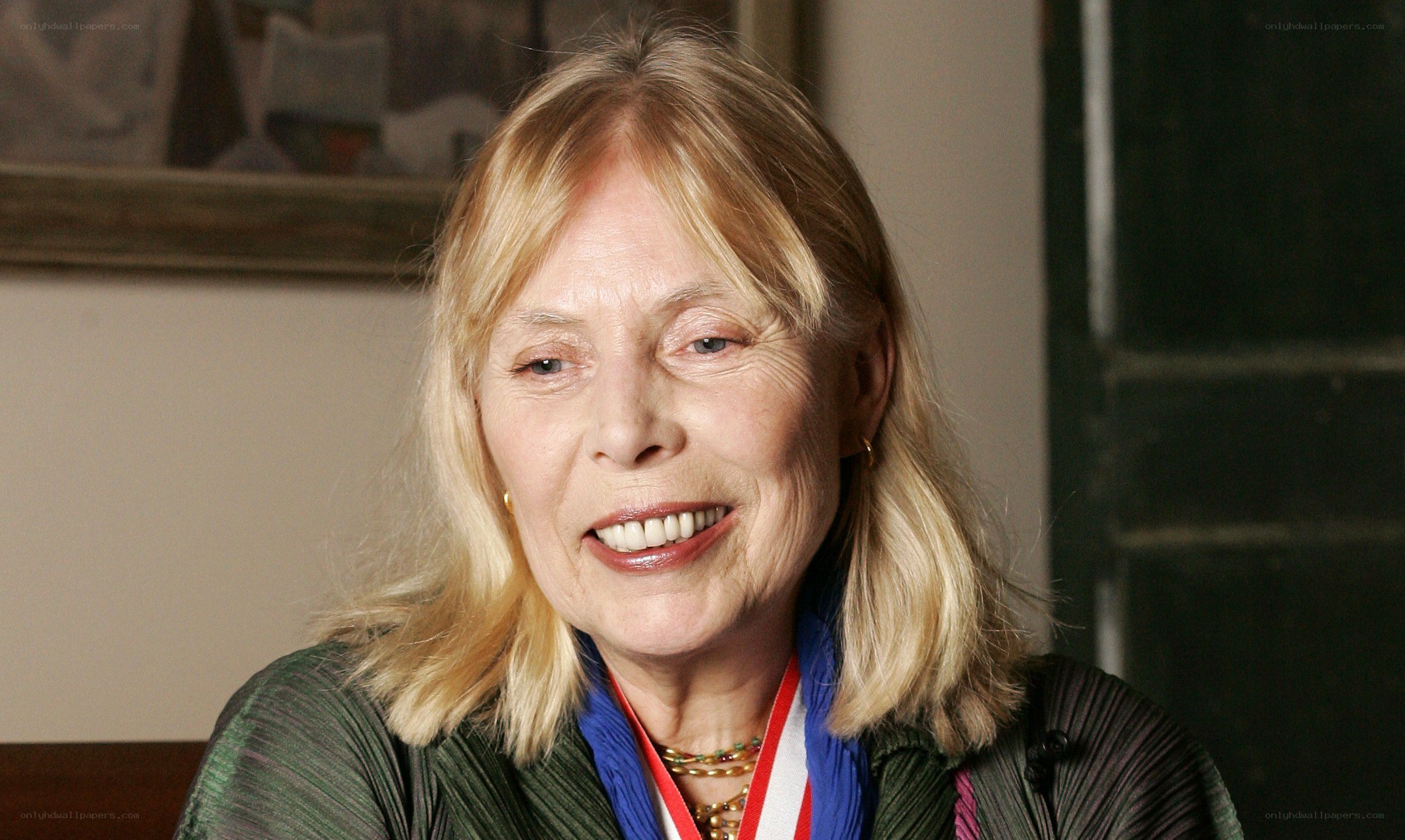 woman with medal smiling