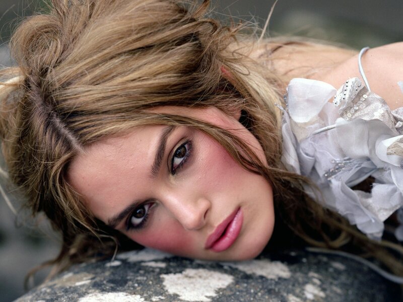 woman with messy hair lying down