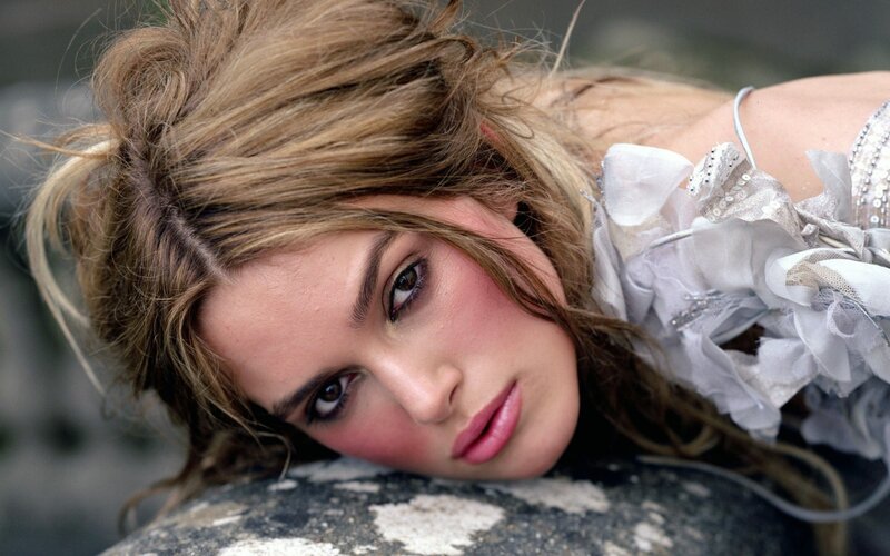 woman with messy hair lying down