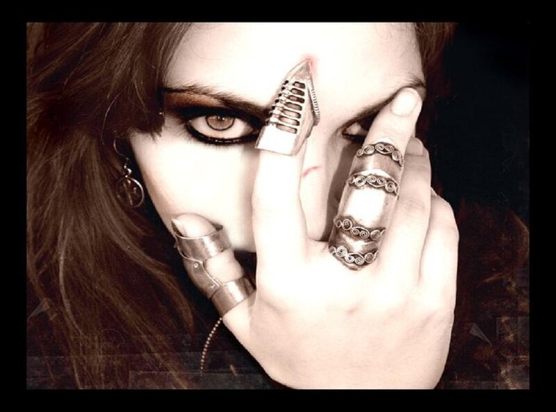 woman with metal finger rings