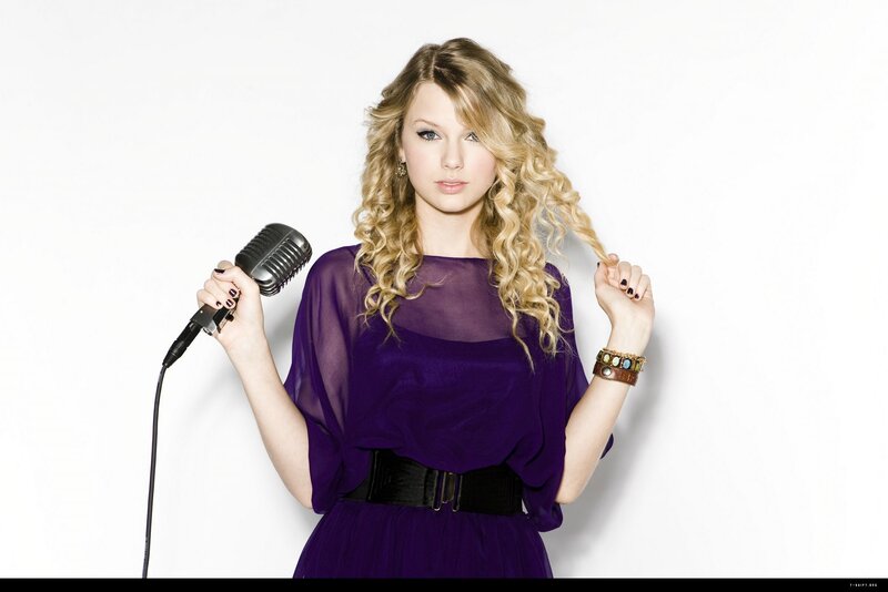 woman with microphone and curls