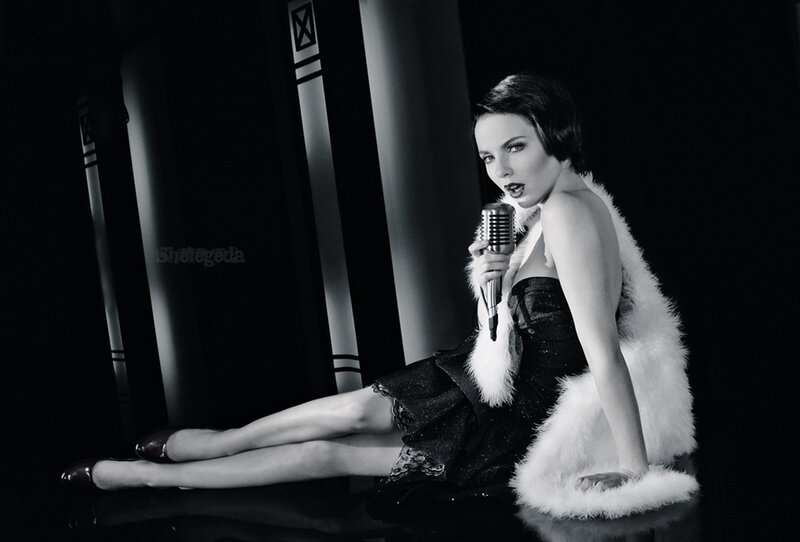 Woman with Microphone — Black, Dramatic, Night