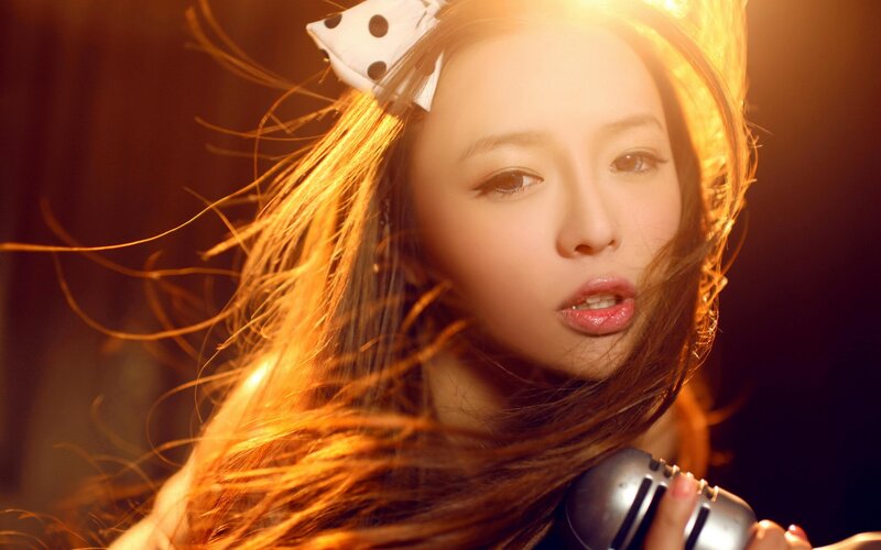 Woman with Microphone — Gold