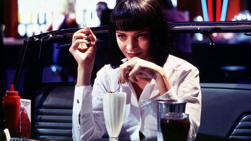 Woman with milkshake at diner